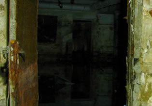 An unused sewage way in 20 Fathoms game is dark and eerie.